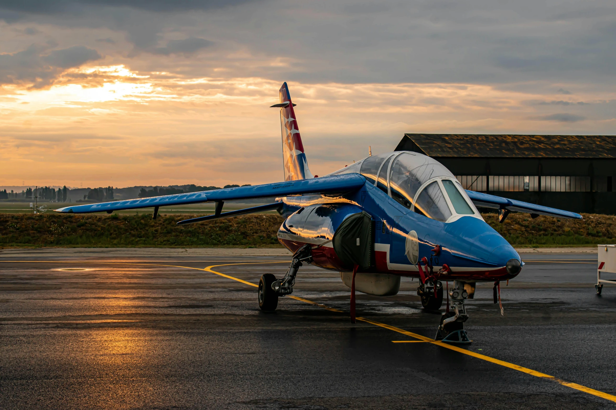 an airplane is parked on the tarmac of an airport