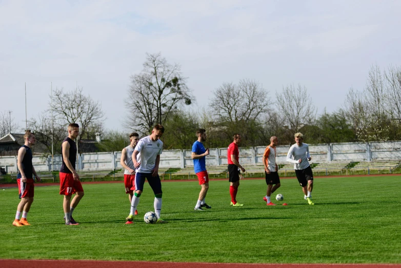 a group of young men playing a game of soccer