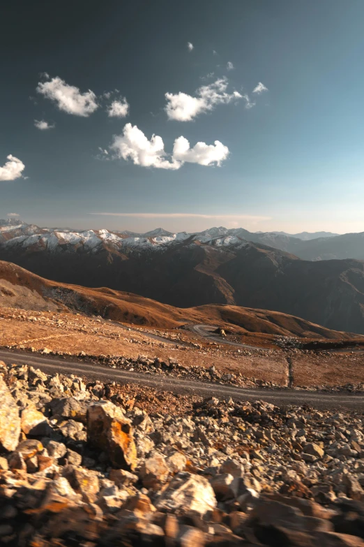 a road winds through the rugged, mountain range