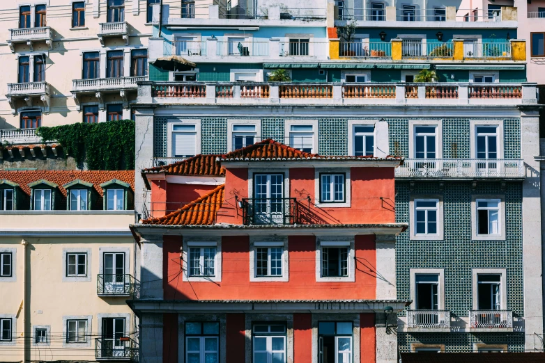 a house with several balconies on the roof