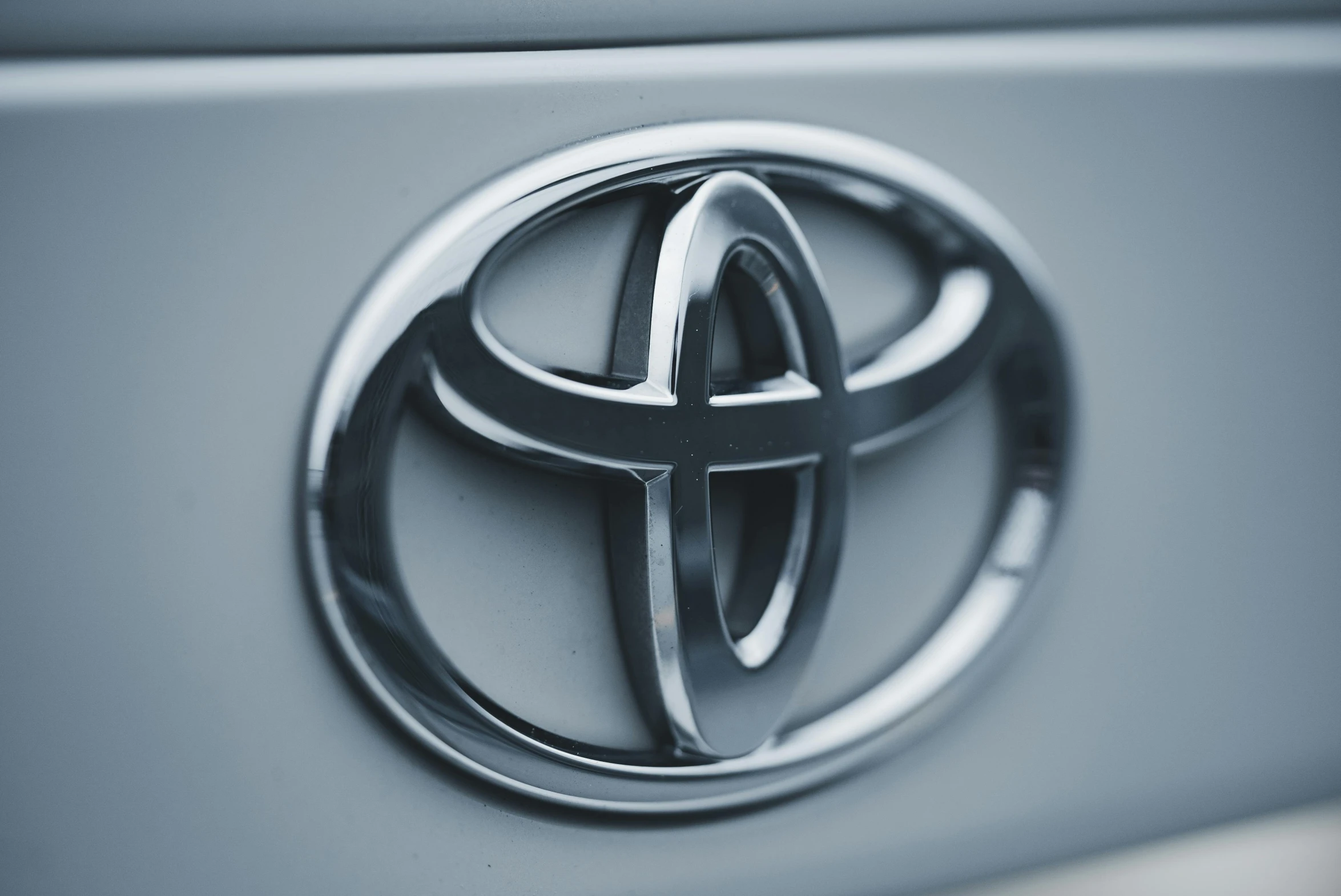 an emblem from the toyota logo on a car