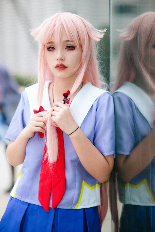 a  wearing a pink wig and red tie