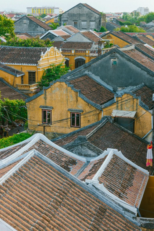 view of rooftops with brown tiles and buildings with red tiles