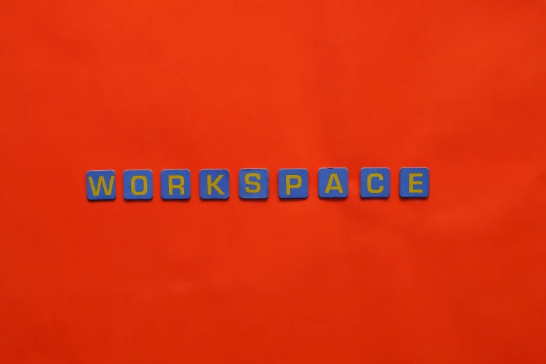 a piece of wood blocks spelling the words workspace