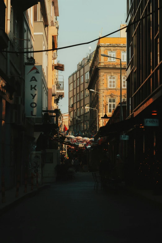 the sun is shining down on a street