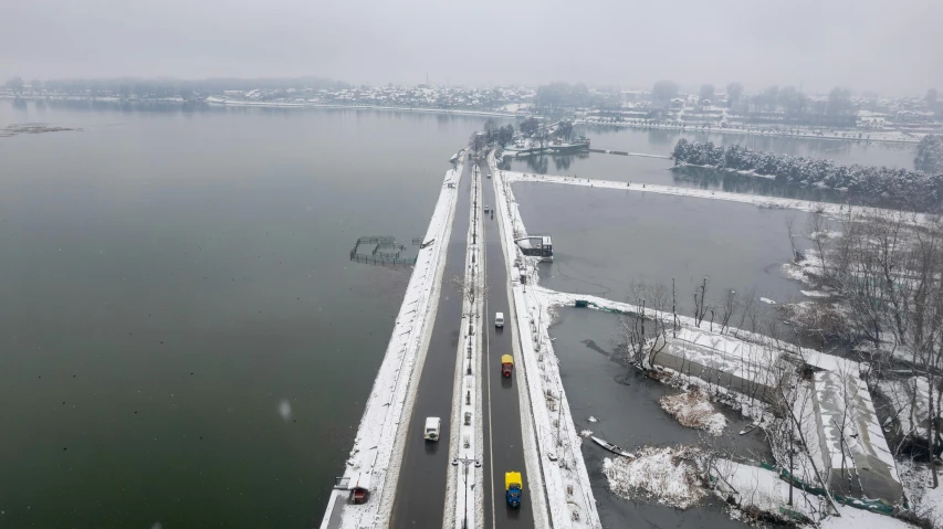 a bridge in the middle of a frozen lake