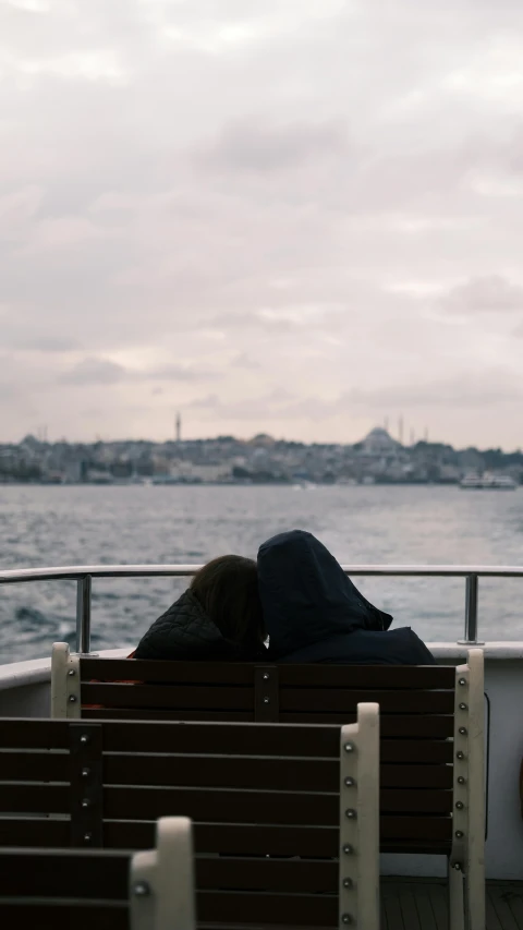 there is a man and woman sitting on the boat