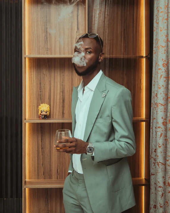 a man in a suit smoking a cigar