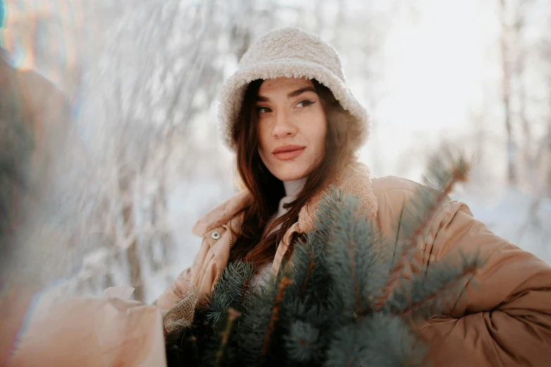 a woman is standing outside in the snow