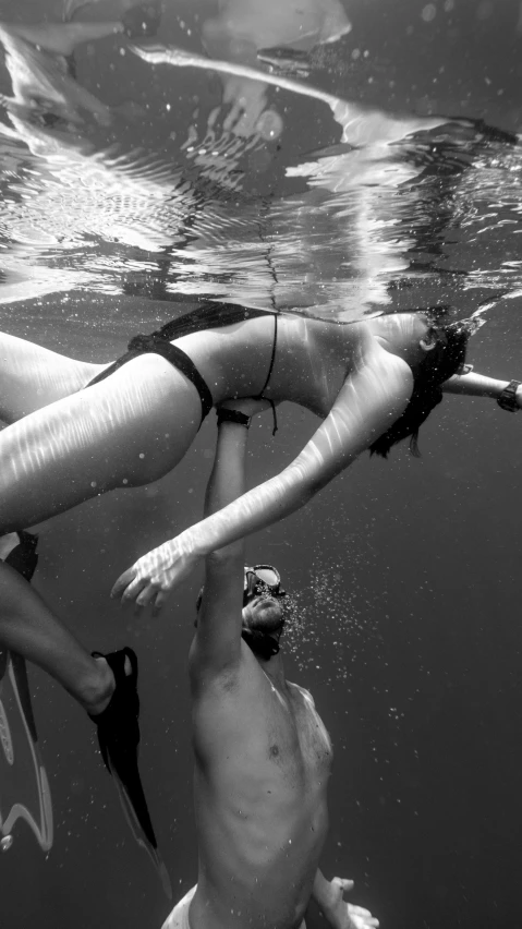 man diving next to woman on the ground