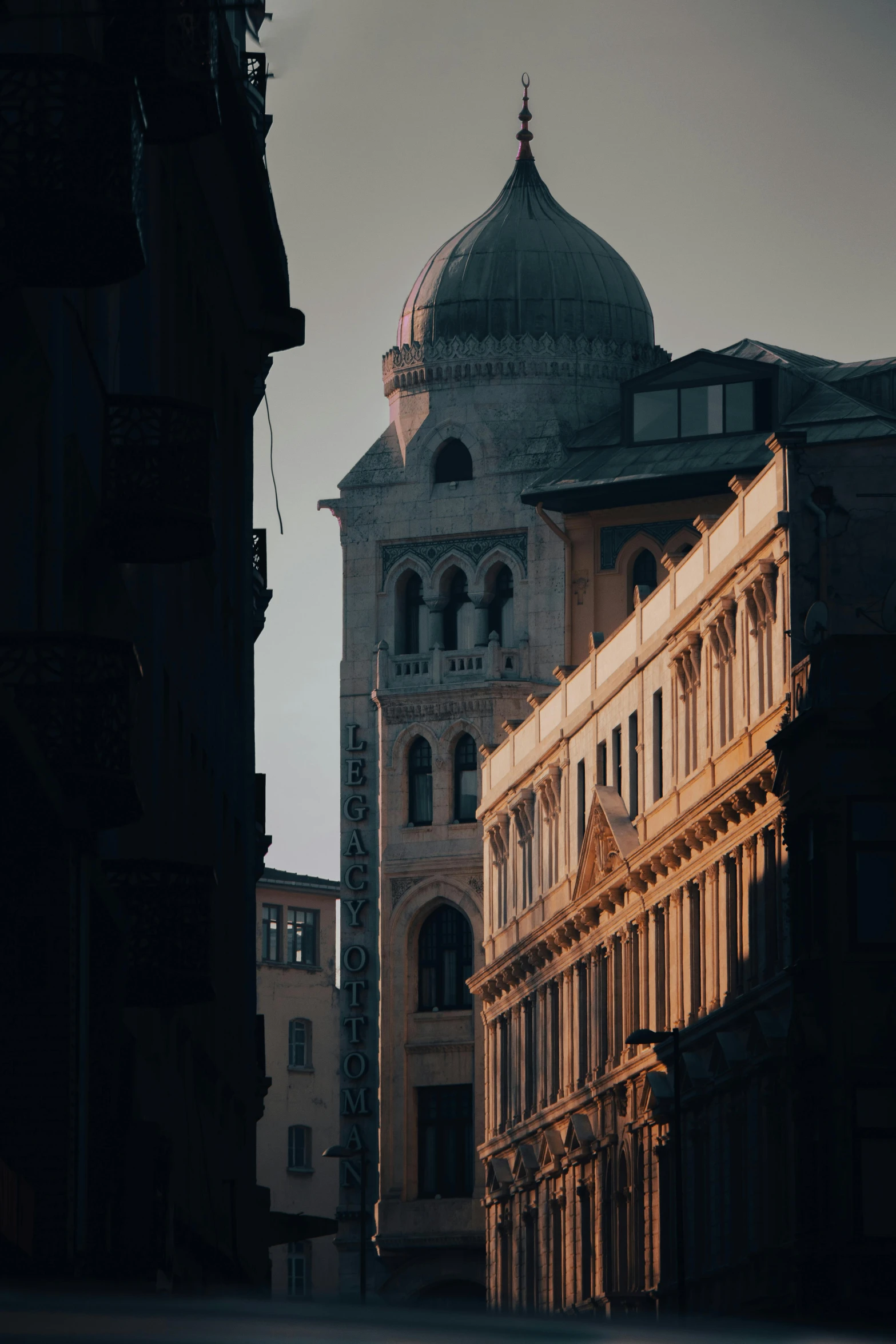 the corner of a building next to another building