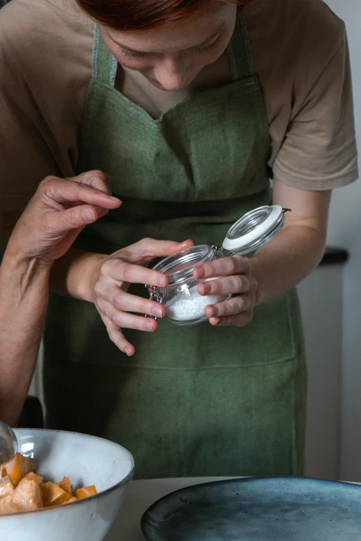 a person in aprons and an apron preparing food