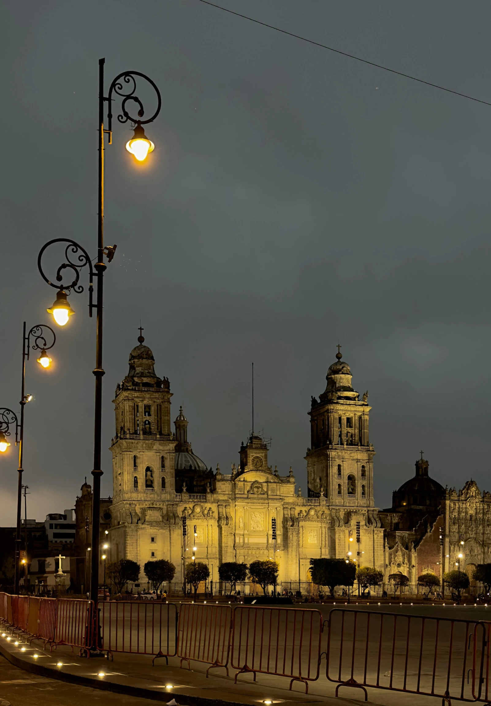 a light and street lights at night by a building