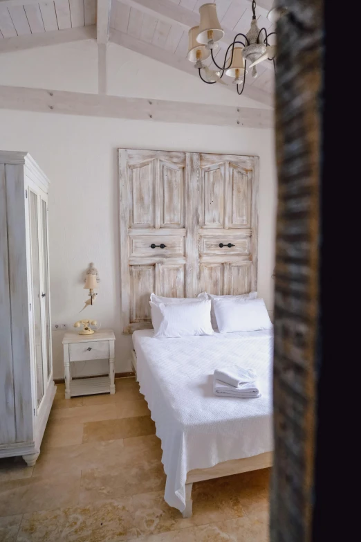 a bed in a room with a wooden head board