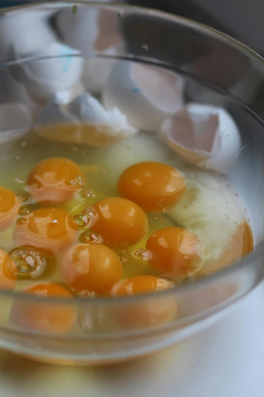 a bowl of eggs that have been cooked in oil