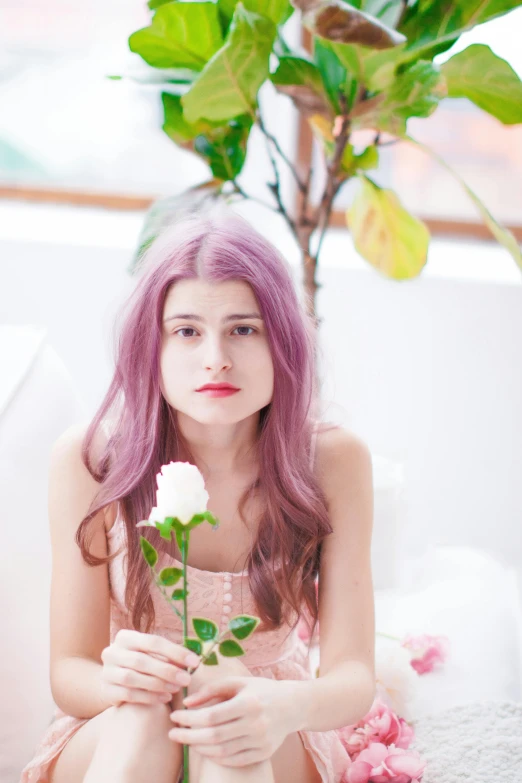 a woman with long pink hair and flowers