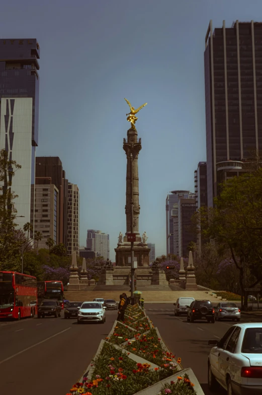 there is a large statue with golden figure in front