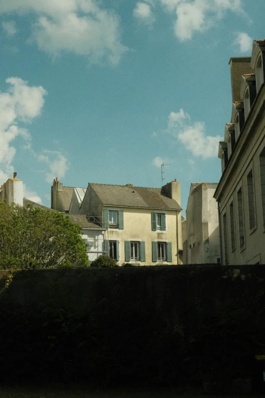 view from the roof of several buildings with shutters on the windows