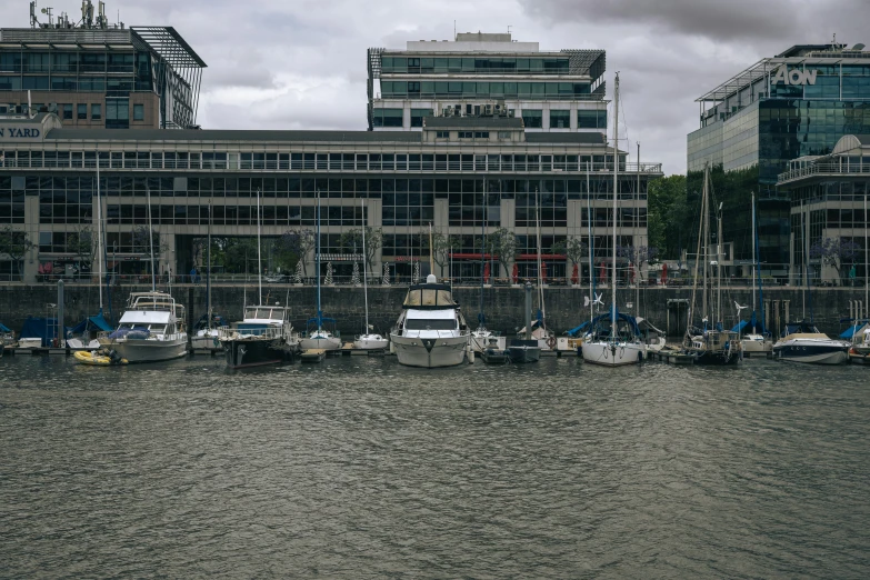 several boats moored in the water at a marina