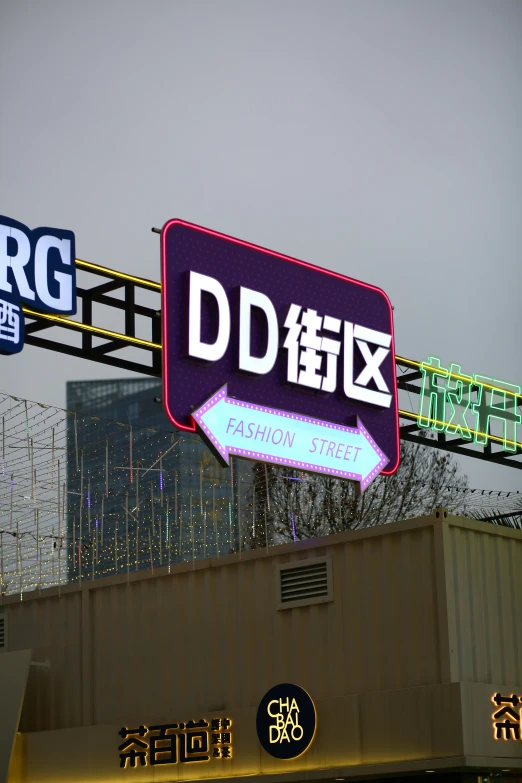 an oriental sign stands with buildings in the background