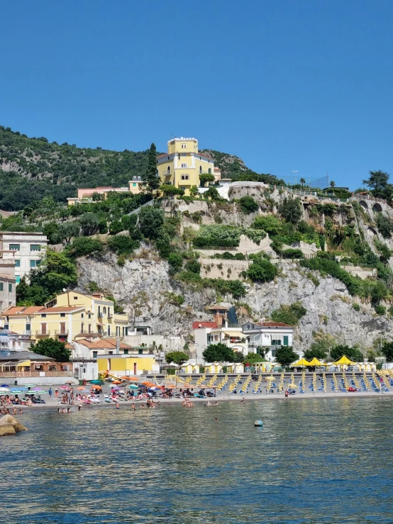 the town on a hill is seen from the sea