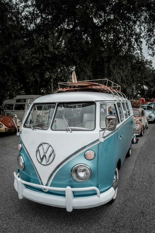 an old vw bus parked in the parking lot