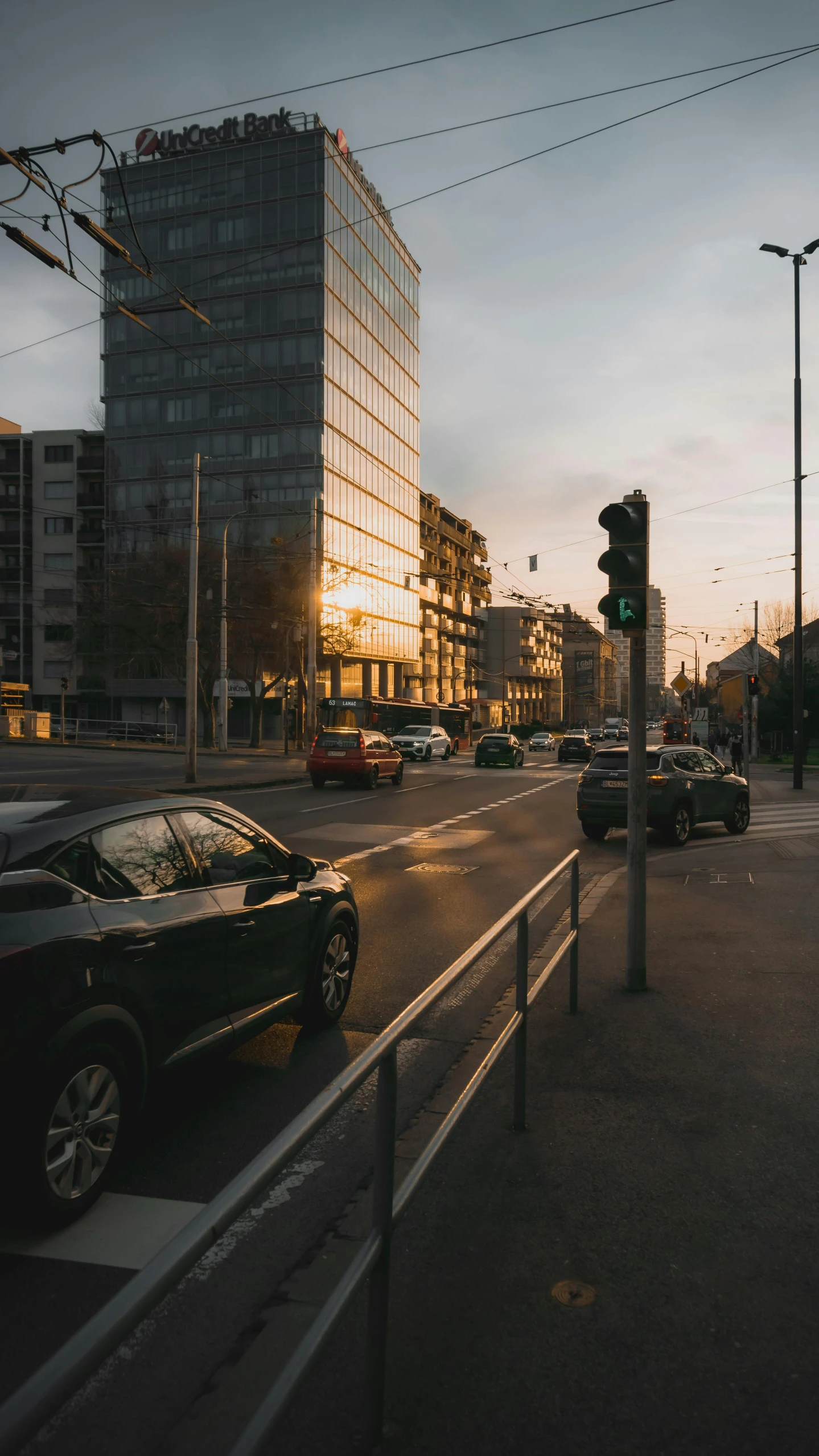 a city street lined with tall buildings next to traffic lights