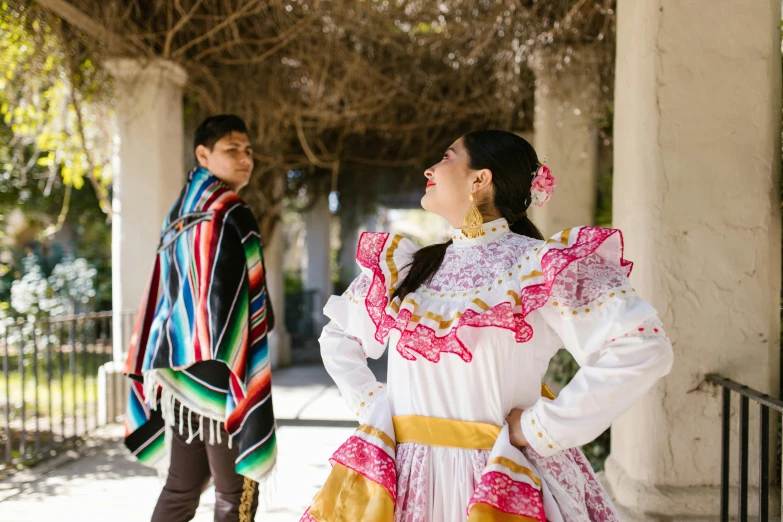 a man and woman dressed up for a spanish day