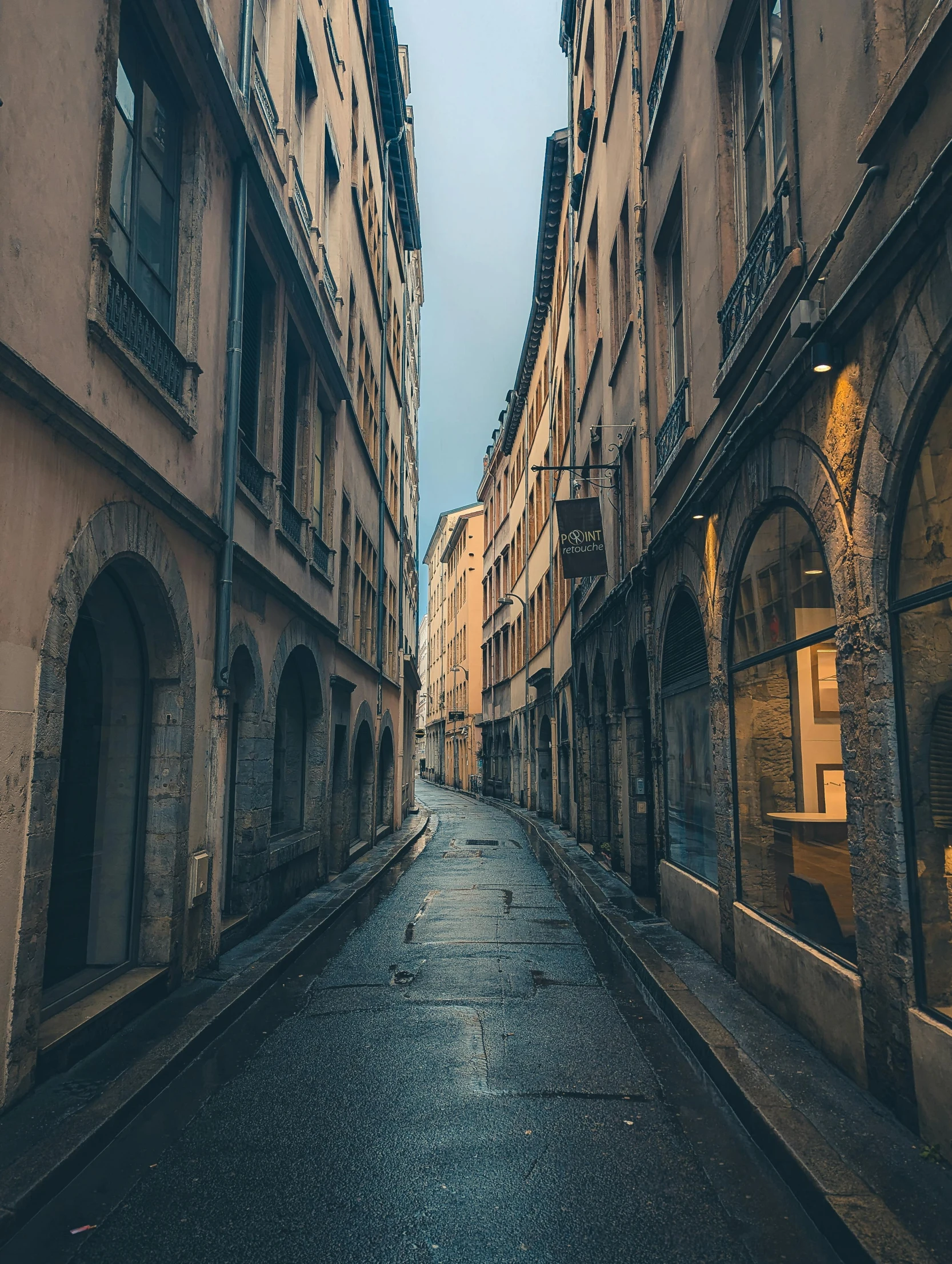 a very narrow road in an old european city