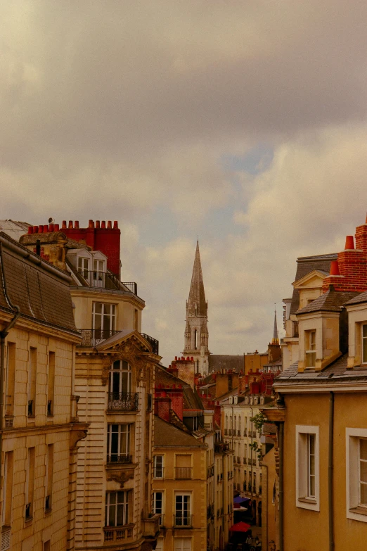 a row of buildings with a clock tower in the distance