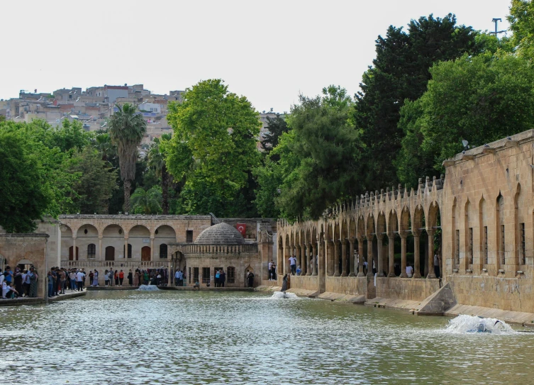 there are many people that are standing around in the water