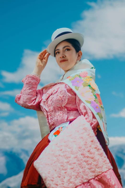 a young lady with a colorful outfit and hat