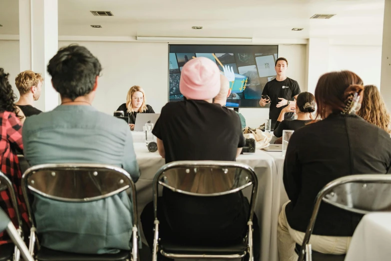 people in the dining room watch an audience