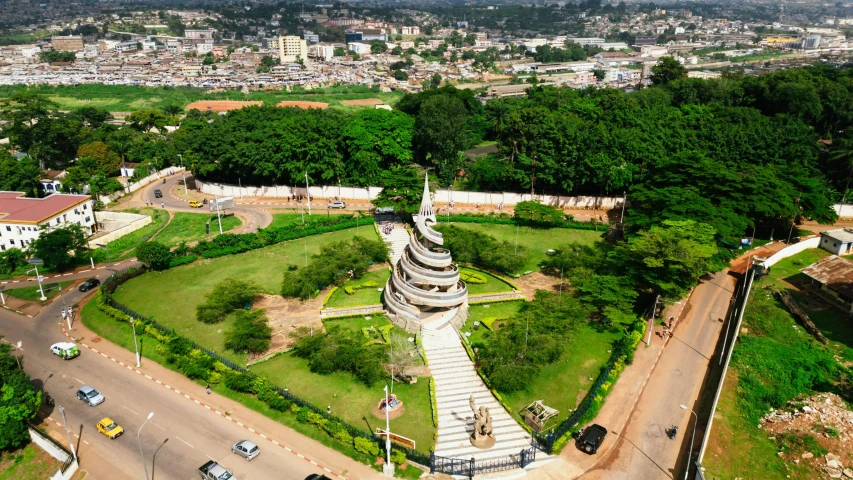 the aerial s shows a circular mound with trees in the background