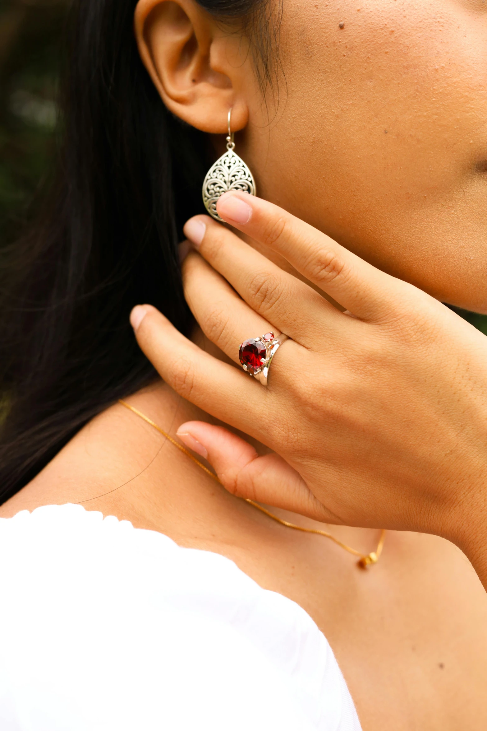 an asian woman holding on to a chain ring