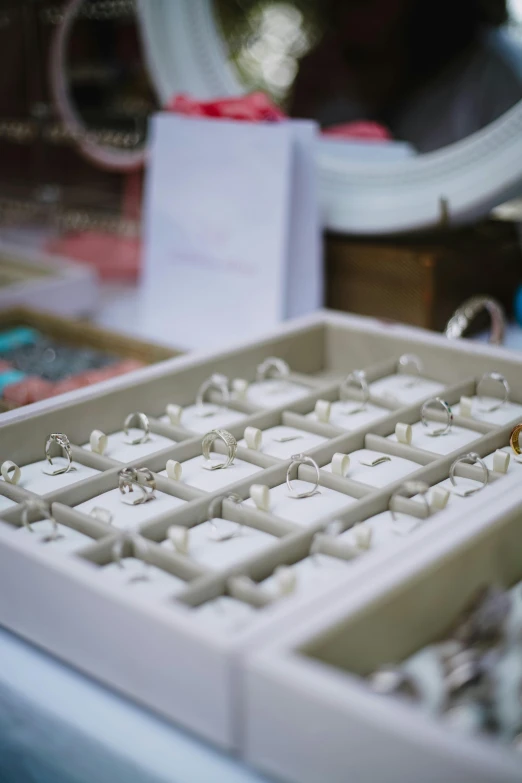 an open box with lots of rings in it