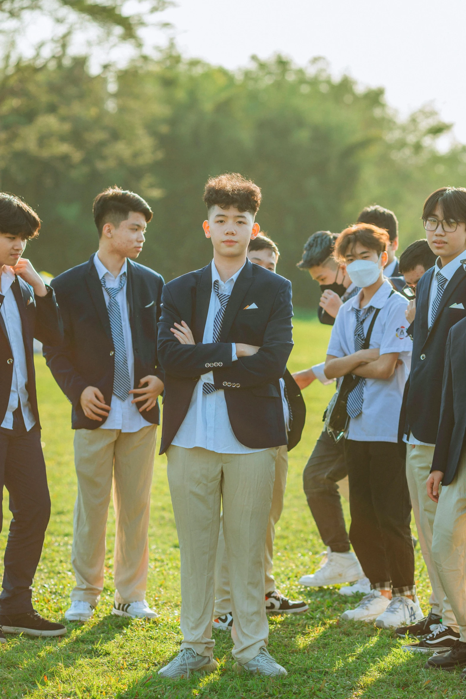 several young men wearing ties standing next to each other