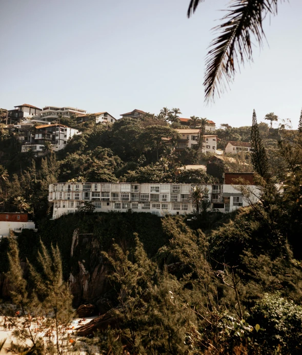 a beautiful view of a hillside with buildings on the edge