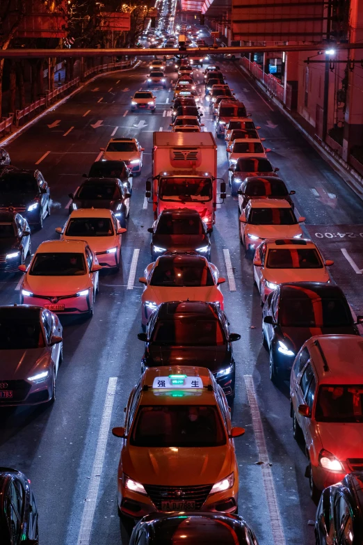 the city street filled with a lot of cars