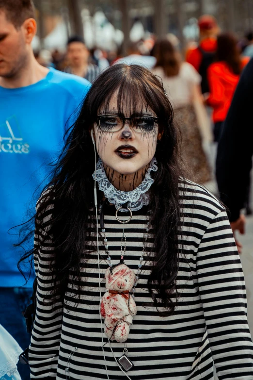 a person with makeup on walking with a handbag