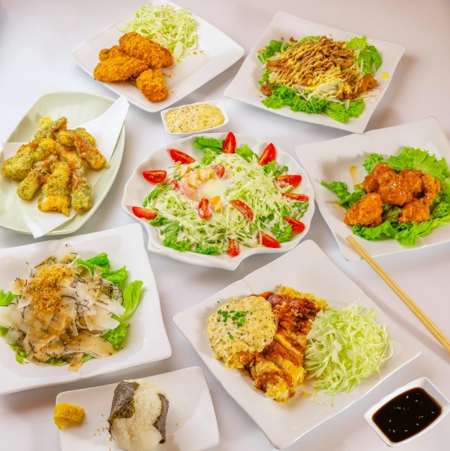 a table that has some plates of food on it