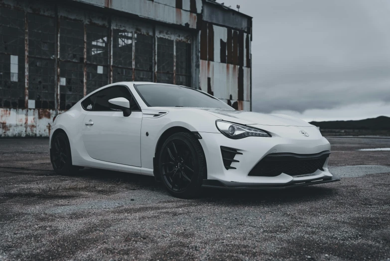 a car is parked outside an industrial building