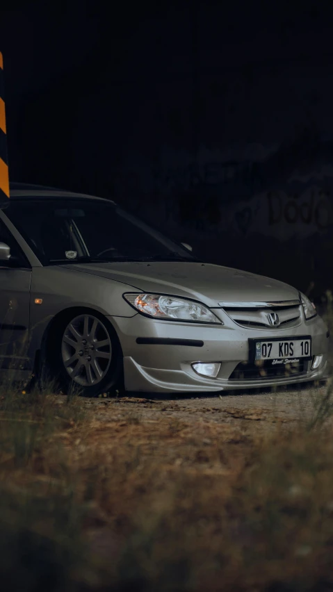 a car parked on top of a field at night