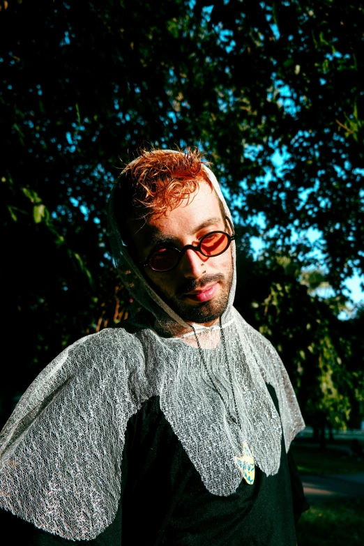 man with shades on and red - haired hair