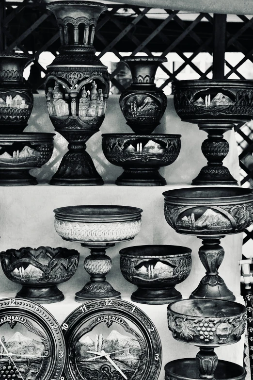 black and white pograph of glass vases on shelves