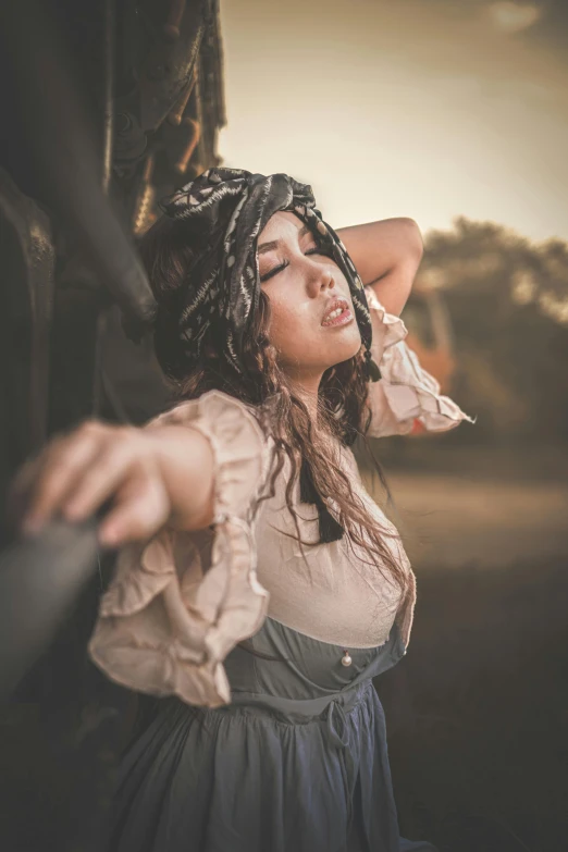 woman dressed in dress sitting on the roof