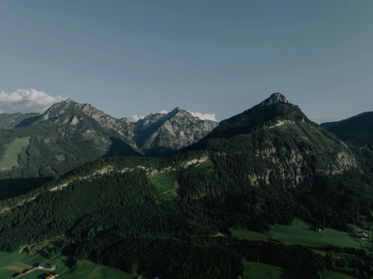 a view of mountains and greenery in the distance