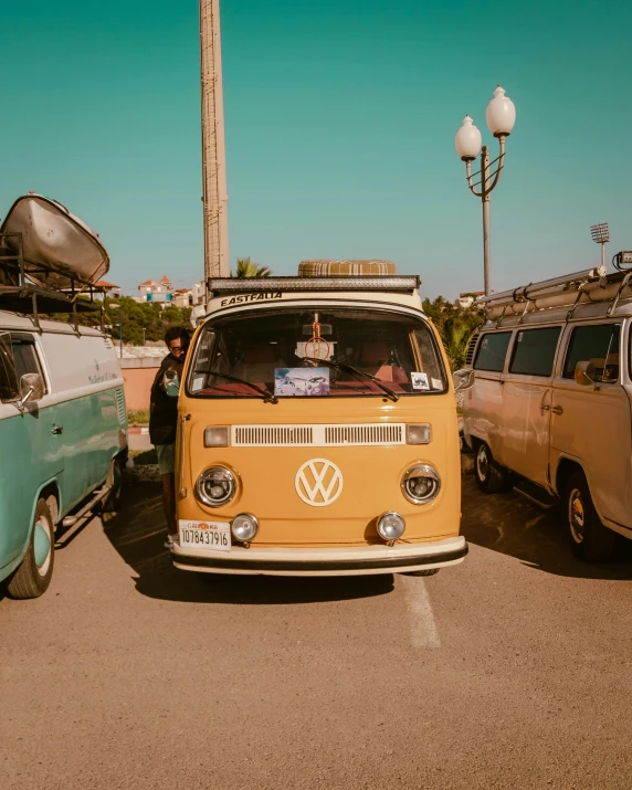 a vw van parked on top of a parking lot