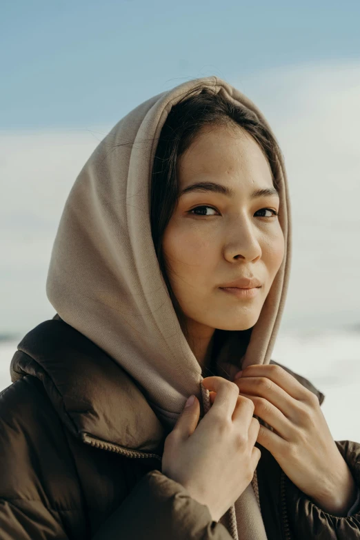 the woman has a shawl on her head