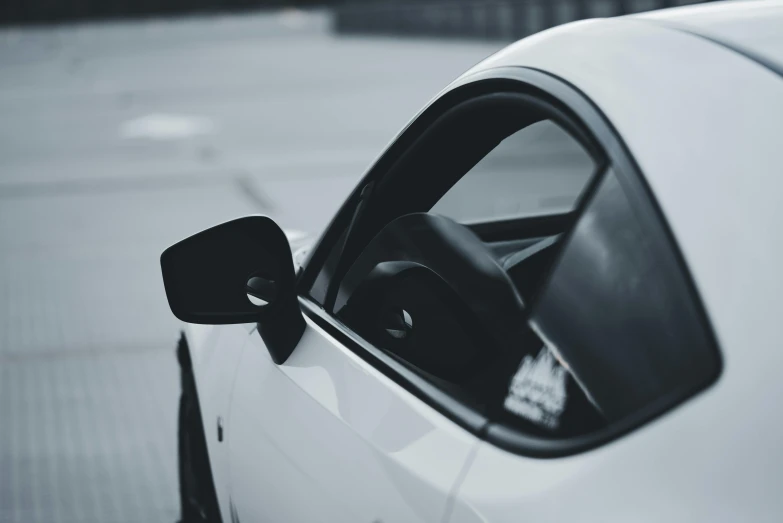 a car parked in the street with its window open